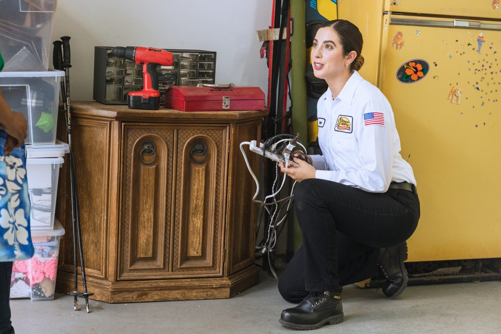 Northern Mister Sparky tech repairing a residential outlet